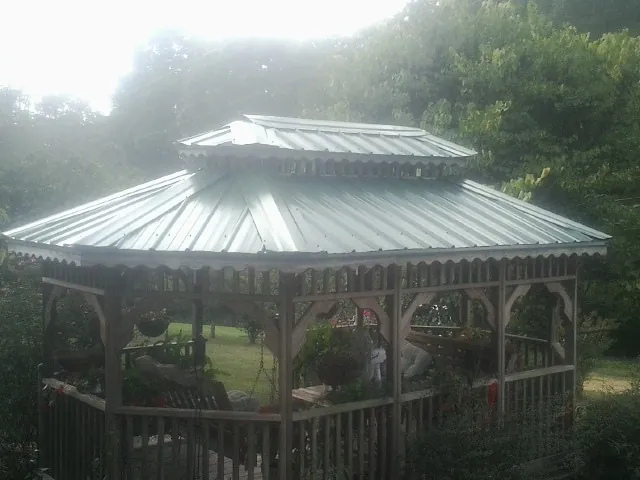 Two tier green metal roof on a garden gazebo in Stevenson Ranch